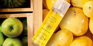 Body Splash de Maracujá do Boticário sobre caixas de frutas